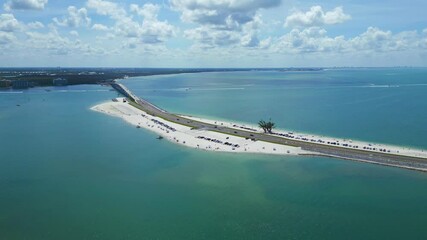 Drone view of beautiful beach on sanibel causeway with beach goers and vacationers enjoying summer day 