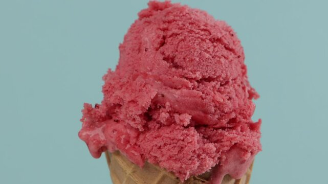 pink sorbet in waffer coner blue background zoom