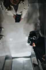 Artistic reflection showcasing individuals interacting in a mirrored space, holding cameras, evoking a sense of creativity, self-passion, and modern artistic style.