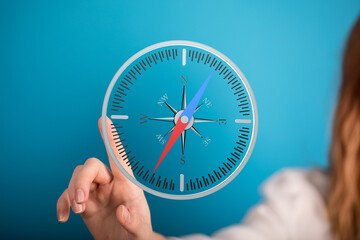 Woman using a digital compass for navigation.  Find your way with this helpful tool.