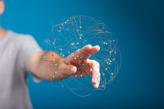 Person's hand interacts with a digital sphere, representing global connections and networking.