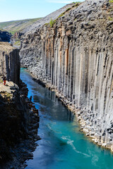Exploring the breathtaking beauty of Studlagil Canyon in Icelands stunning landscape