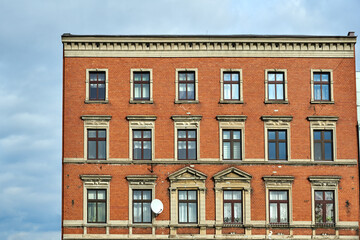 Fototapeta premium The historic red brick tenement house in the city of Gniezno