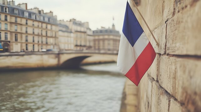 France, French flag, Tricolor, French Flag Hanging on Parisian Wall with Blurred River and Buildings