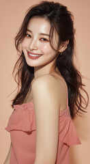 Fototapeta premium A beautiful Asian woman with long flowing hair, fair skin and a bright smile is dressed in an elegant sleeveless top. Her features are radiant, suitable for beauty salons, skin care products