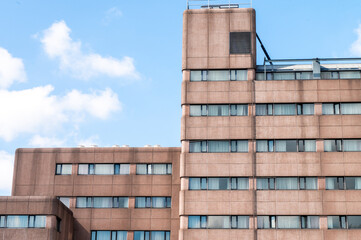 Urban architecture of a modern high-rise building against a clear sky