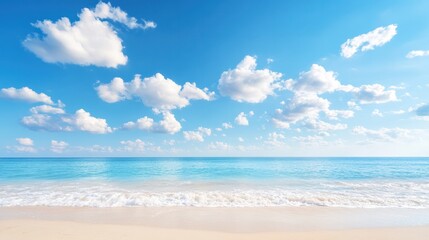 A serene beach scene featuring clear blue water, soft waves, and a bright sky scattered with fluffy clouds.