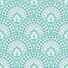 Dotted waves scalloped seamless pattern. Scallop half tone circle geometrical ornament.  Hand drawn small green and blue dots and curve arch on white background. Repeat allover backdrop