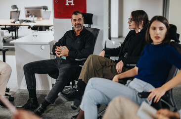 Business professionals gathered in a modern office setting, engaging in a collaborative discussion....