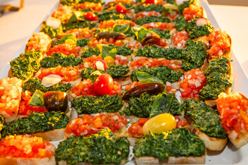 Bread with basil pesto and tomato and onion