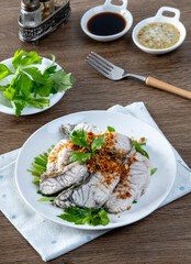 Steamed sea bass with dipping sauce