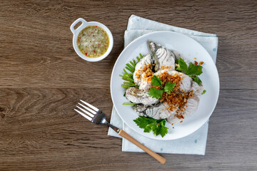 Steamed sea bass with dipping sauce