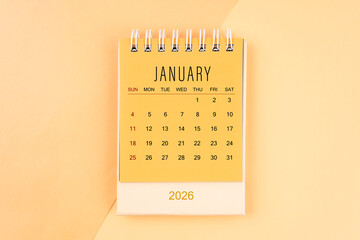 January 2026 mini desk calendar on the yellow, planning for business meeting concept.
