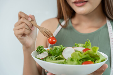 slim body asian women choose healthy foods, dieting female choose salad for diet. Good healthy...
