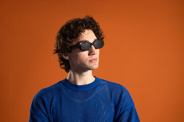 Obraz premium Young Man Posing in Sunglasses