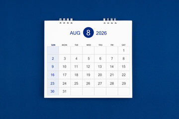 August 2026 Monthly desk calendar on navy blue color leather background.