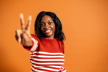 Young Woman Gesturing Towards the Camera