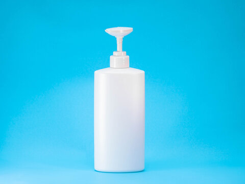 White Plastic Pump Bottle on Blue Background