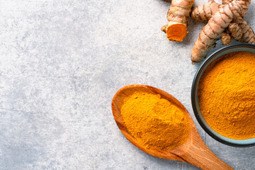 Turmeric with its magnificent orange color on a vintage white background	