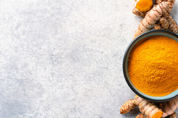 Fototapeta premium Turmeric with its magnificent orange color on a vintage white background 