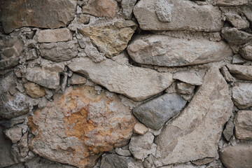 Texture of a massive Greek stone with various shades in Crete