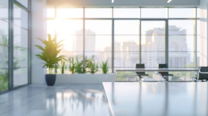 Fototapeta premium Blurred office interior background. Empty light open space office with big windows, many glasses walls, desks, chairs and green plants. Modern indoor business environment