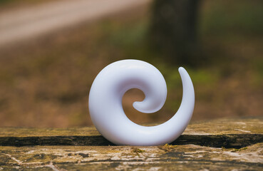White spiral ear extension for tunnel.