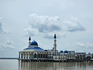 Floating on a sea of tranquility, this mosque is a sight to behold.  The perfect blend of architecture and nature.