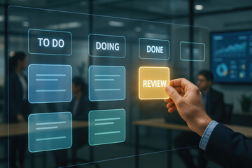 The process task management advances as a selects the review phase on a digital kanban board in a modern office