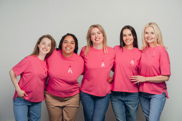 Women of different ethnicities and ages supporting breast cancer awareness