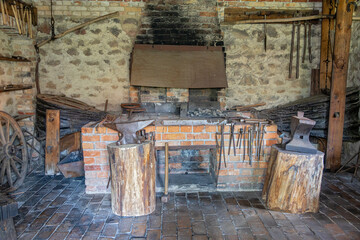 Equipment of a historic forge with a fireplace and bellows