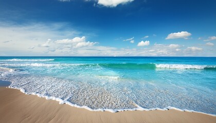 Fototapeta premium serene ocean waves and tranquil shoreline under blue sky
