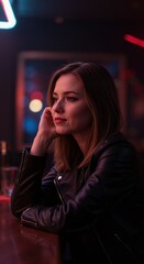 Young woman sitting at bar while looking thoughtfully to side  