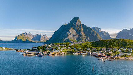Breathtaking village of Reine nestled among towering mountains in Lofoten, Norway