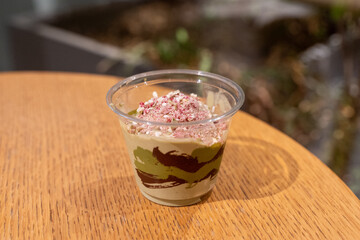 Cup of layered dessert with sprinkles