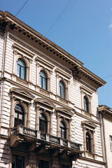Fototapeta premium Facade of an old historic building in a European city, vintage architecture.