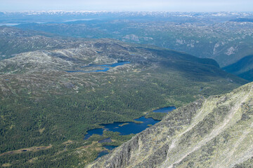 Obraz premium Lakes and Forest Landscape Stretching Below Gaustatoppen