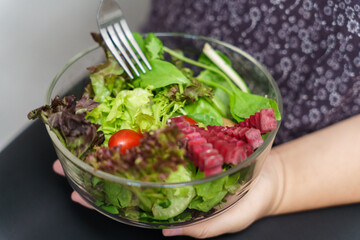 Asian Overweight woman dieting Weight loss eating fresh fresh homemade salad healthy eating concept Obese Woman with weight diet lifestyle.