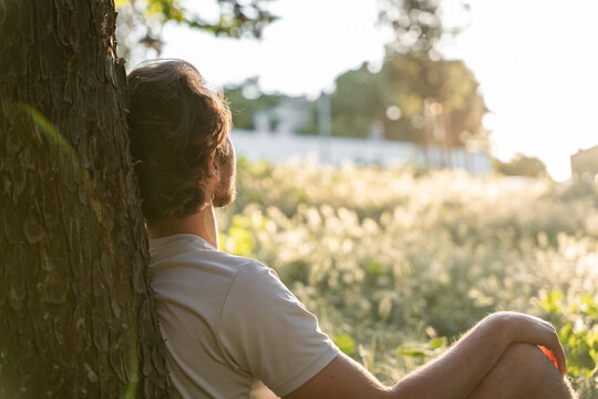 Relaxed man enjoying good weather in a natural setting