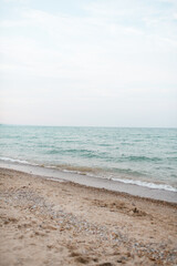 Scenic view of waves rolling in onto Lake Michigan beach at Fort Sheridan preserve in Illinois with copy space 