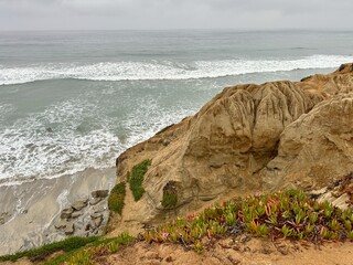 Close-up details of natural erosion patterns visible on the rugged sea bluffs in Carlsbad,...