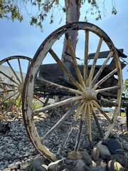 A charming rustic wagon, repurposed as a decorative roadside accent, adding a touch of vintage...