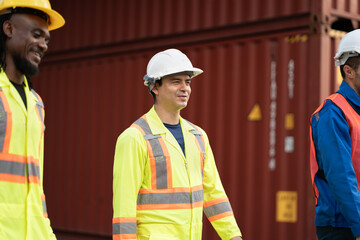 Caucasian worker man working with checking container at container site	