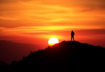 Fototapeta premium Sunset silhouette of a lone figure on a hilltop, stark against fiery sky, sacrifice, epic