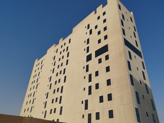 White Color Commercial Residential Building Complex with Black Color Windows And Blue Sky...