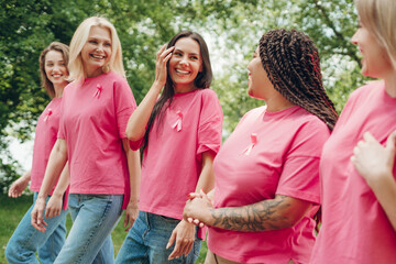 Diverse women walking together for breast cancer awareness