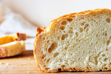 Freshly baked artisanal bread loaf sliced to reveal soft interior and crusty exterior