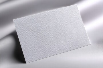 Textured white paper with fine lines set against a smooth backdrop emphasizing elegance and minimalism creating a sophisticated design element for creative projects