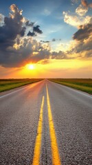 Fototapeta premium Golden Sunset Above a Long Stretch of Open Road in a Scenic Countryside Landscape