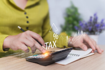 Tax planning concept, money that must be withheld from the government, businessman enters data into a calculator to report income to the tax office, to pay taxes as a civic duty  as required by law